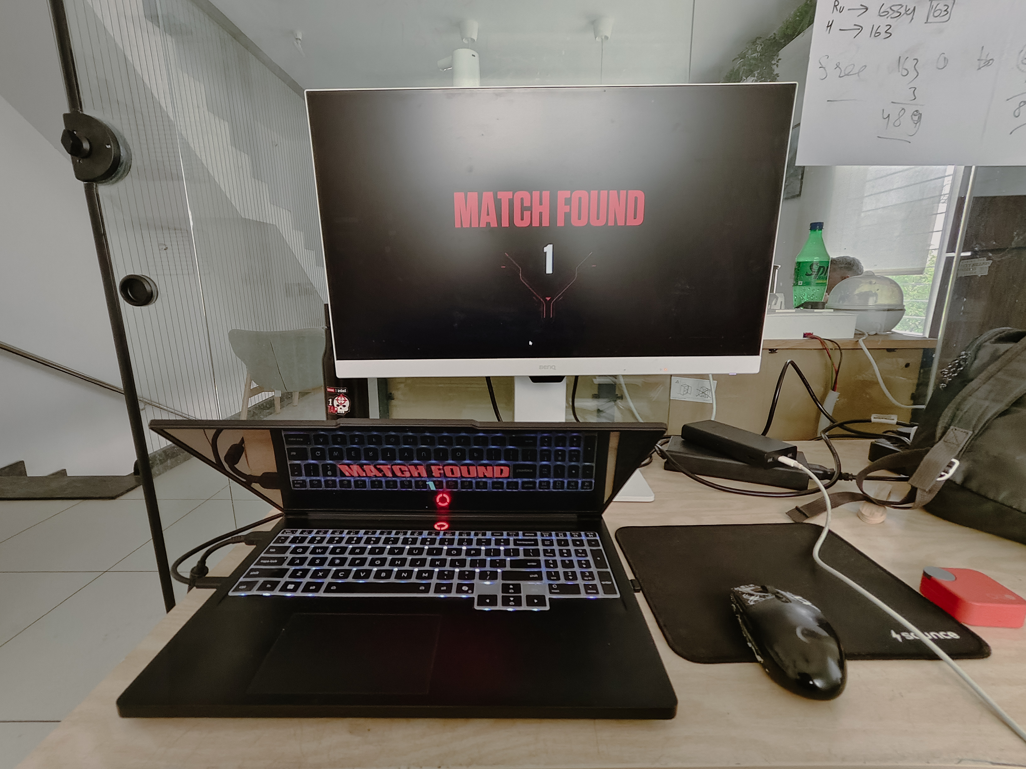 Office setup at RaazMD showing Match Found on BenQ monitor, Golam Sayon Ahamed&rsquo;s workstation with RGB keyboard lit up, same desk used for design work and occasional games on slow afternoons